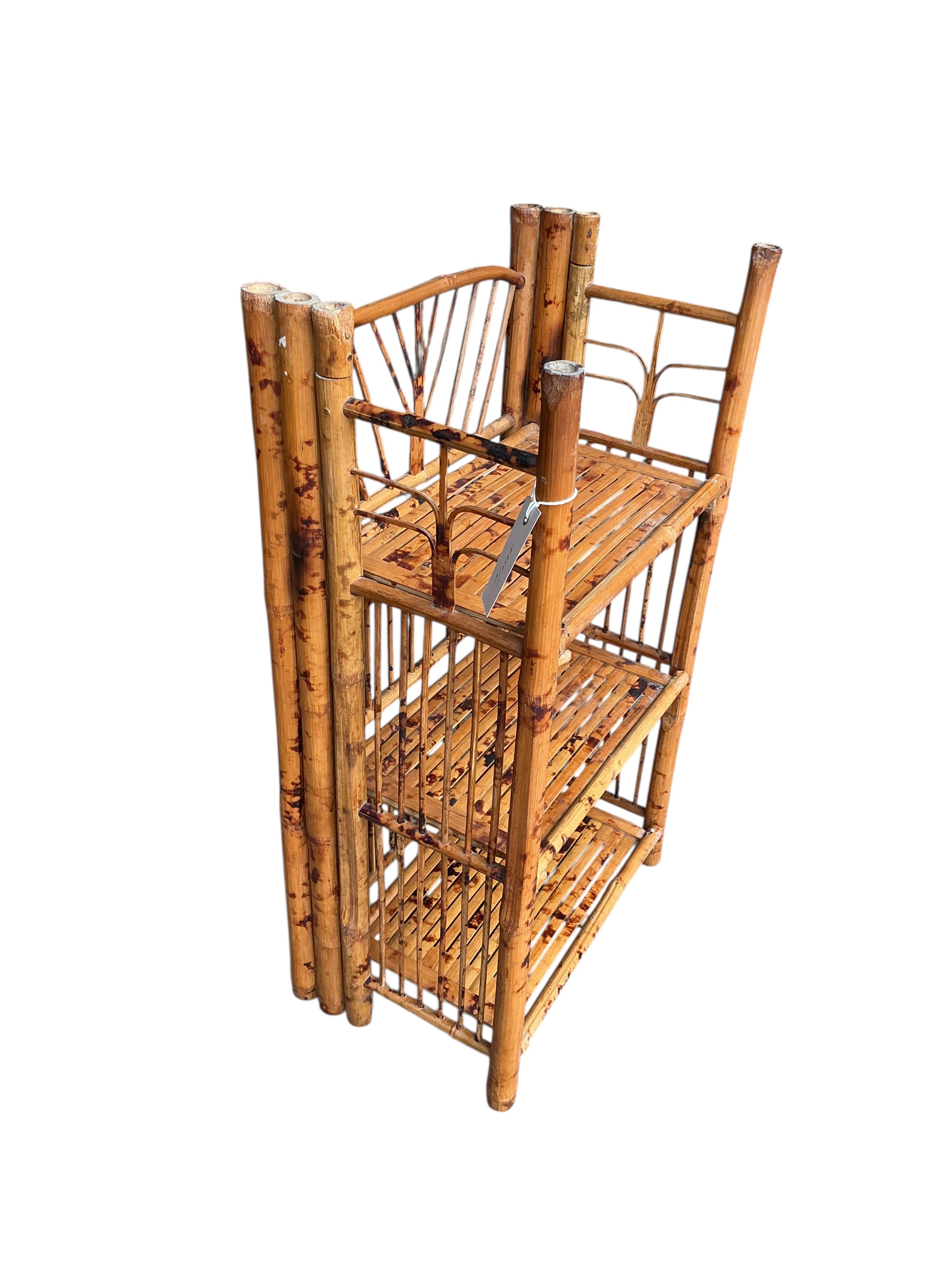 A folding bamboo open shelf unit, width 36cm, depth 23cm, height 66cm